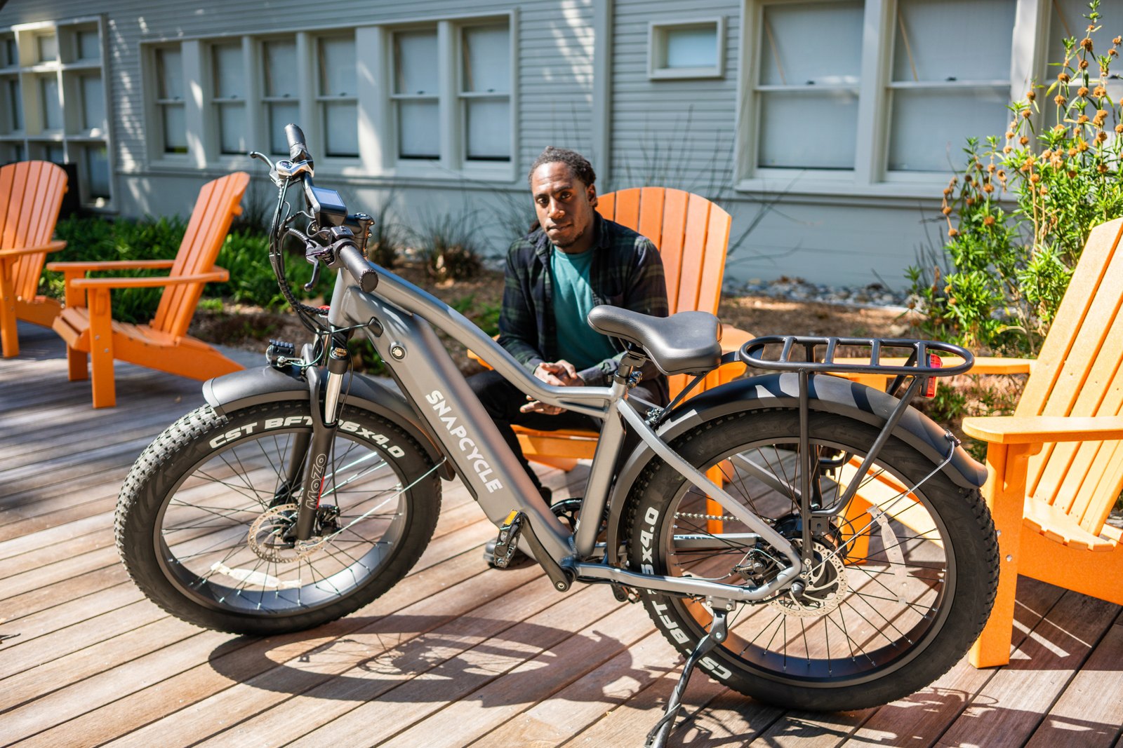 Snapcycle e-bikes on a wooden deck in a relaxed home setting