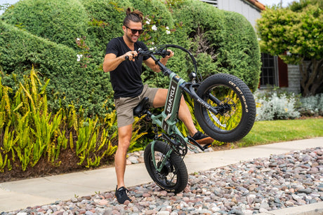 Snapcycle e-bike on an outdoor path surrounded by greenery